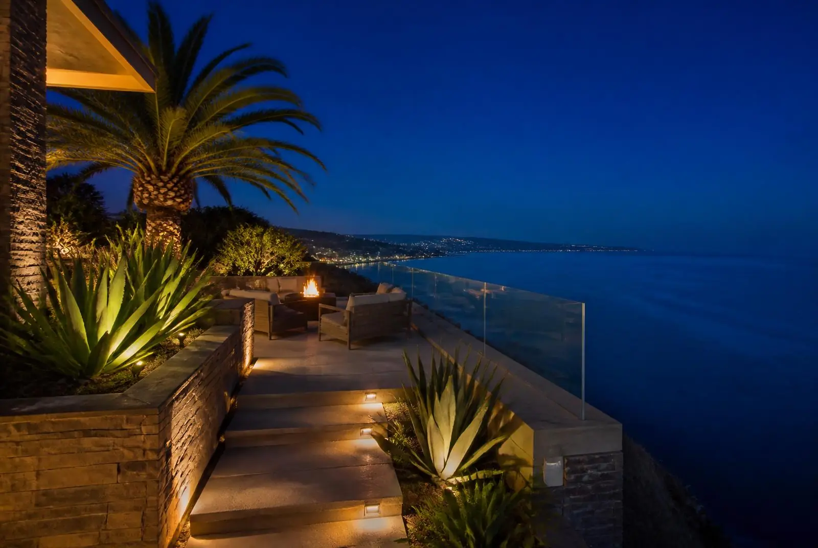 Rancho Palos Verdes clifftop ocean-view terrace with low-glare step lighting at night