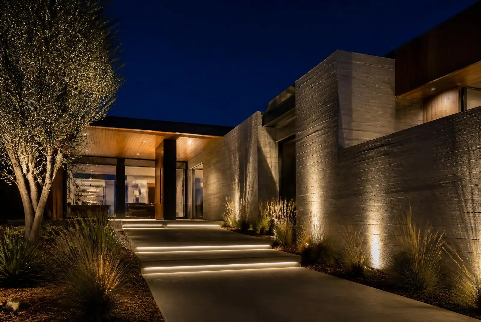 Irvine modern contemporary home with subtle in-grade path lighting at night